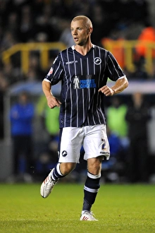 Season 2013-14 Prints: Millwall vs Blackpool: Sky Bet Championship Showdown at The Den - Alan Dunne in Action