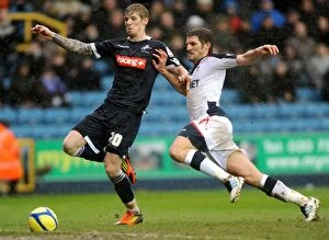 Images Dated 18th February 2012: Millwall vs Bolton Wanderers: FA Cup Fifth Round Clash - Intense Battle Between Andrew Keogh