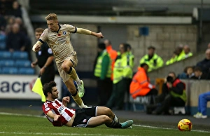 Millwall vs. Brentford: Lee Martin vs. Jon Toral Tackle in Sky Bet Championship at The Den