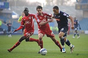 Images Dated 20th November 2011: Millwall vs Bristol City: Intense Battle Between Feeney and Skuse, Adomah at The Den