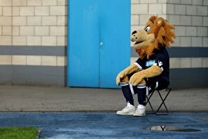 01-10-2011 v Burnley, The Den Collection: Millwall vs. Burnley: The Den - A Football Rivalry Unfolds with the Millwall Mascot in Attendance