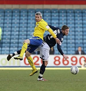Images Dated 19th March 2011: Millwall vs. Cardiff City: A Championship Battle at The New Den - Henry vs. McNaughton (19-03-2011)