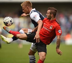 Images Dated 15th August 2015: Millwall vs Coventry City: Intense Battle for Supremacy in Sky Bet League One - Byron Webster vs