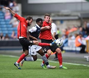 Images Dated 15th August 2015: Millwall vs Coventry City: Intense Battle Between Fred Onyedinma and Coventry's Jim O'Brien