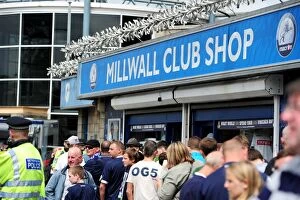 Images Dated 13th August 2011: Millwall vs Nottingham Forest: The Den - Excited Fans Gather Outside the Club Shop
