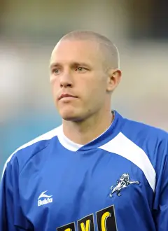 Previous Season Prints: Millwall vs Oldham Athletic in Football League One: Gary Alexander at The New Den (August 18)