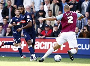 Images Dated 17th September 2011: Millwall vs. West Ham United: Liam Trotter vs. Winston Reid in the Npower Championship Clash at