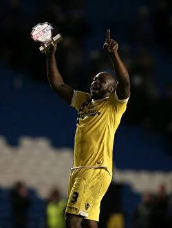 Images Dated 12th December 2014: Millwall's Glory: Danny Shittu's Victory Celebration at AMEX Stadium (Sky Bet Championship)