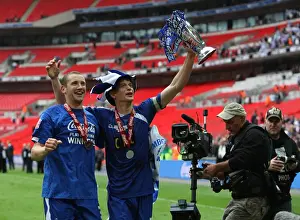 Millwall V Swindon League One Play-off Final Prints: Millwall's Triumph: Frampton and Robinson Rejoice with the Football League One Play-Off Trophy at Wembley