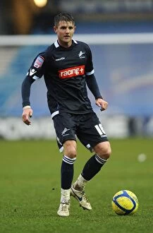 Images Dated 18th February 2012: Scott Barron's Unwavering Determination: Millwall vs Bolton Wanderers in FA Cup Fifth Round at The