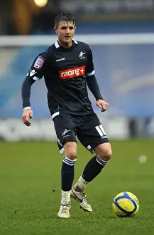 Season 2011-12 Prints: Scott Barron's Unwavering Determination: Millwall vs Bolton Wanderers in FA Cup Fifth Round at The Den