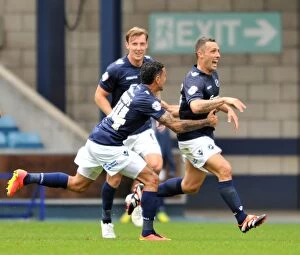 Images Dated 30th August 2014: Scott McDonald's Thrilling Debut Goal for Millwall: A Jubilant Celebration with Team Mates at The