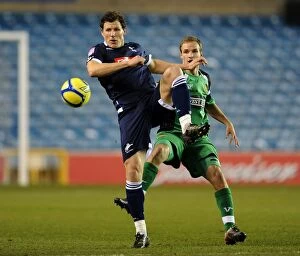 Images Dated 17th January 2012: A Striker Showdown at The Den: Henderson vs Doe in FA Cup Third Round Replay