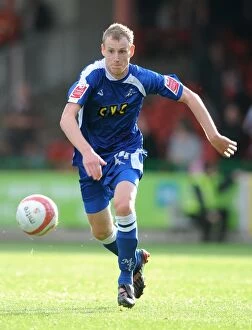Images Dated 10th October 2009: Swindon Town vs Millwall in Football League One: Intense Moment at County Ground with Marc Laird