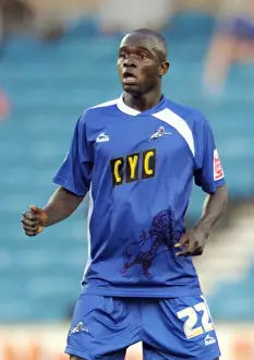 A Tense Moment at The New Den: Millwall's Ali Fuseini Faces Off Against Oldham Athletic in Football League One (August 18, 2009)