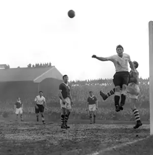 Vintage FA Cup: Millwall vs Birmingham City - Aerial Battle: Gil Merrick Saves Birmingham from Millwall's Shepherd